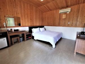 Postel nebo postele na pokoji v ubytování 四重溪可以居民宿 Fine Inn