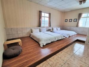 Postel nebo postele na pokoji v ubytování 四重溪可以居民宿 Fine Inn