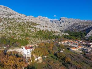 an aerial view of a village in the mountains at Apartmani Villa Paulo in Starigrad-Paklenica