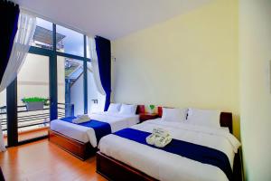 Postel nebo postele na pokoji v ubytování Bách Thảo Hotel