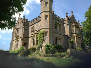 an old castle with a tower on top of it at Greenham Hall in Wellington