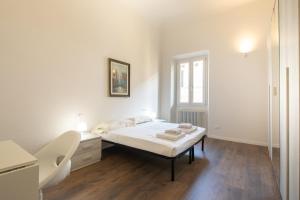 Posteľ alebo postele v izbe v ubytovaní Indipendenza House by Mmega