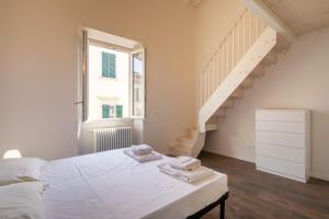 Posteľ alebo postele v izbe v ubytovaní Indipendenza House by Mmega