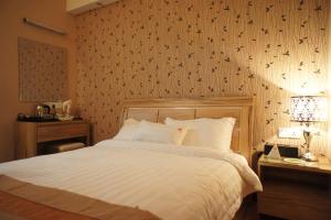 Postel nebo postele na pokoji v ubytování Hotel Balik Pulau