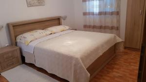 Ein Bett oder Betten in einem Zimmer der Unterkunft Ruzica Apartments