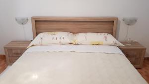 Ein Bett oder Betten in einem Zimmer der Unterkunft Ruzica Apartments