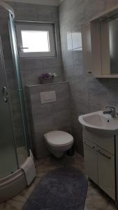 Ein Badezimmer in der Unterkunft Ruzica Apartments