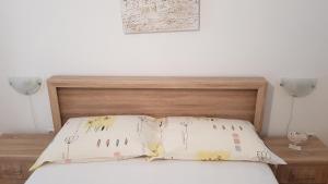 Ein Bett oder Betten in einem Zimmer der Unterkunft Ruzica Apartments