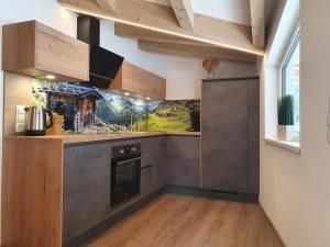 Kuchyň nebo kuchyňský kout v ubytování Alpen Appartements Viehhofen near Saalbach & Zell am See - incl Sommercard