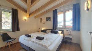 Postel nebo postele na pokoji v ubytování Alpen Appartements Viehhofen near Saalbach & Zell am See - incl Sommercard