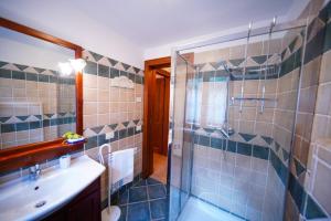 a bathroom with a tub and a sink and a shower at Fonte Murata B&B in Portoferraio +51 photos