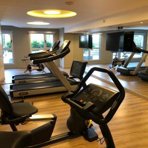 a gym with several exercise bikes and a treadmill at Hotel Soho Suites in San Francisco