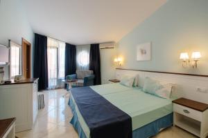 a hotel room with a large bed in a room at Hotel Evridika in Nesebar +96 photos