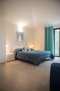 A bed or beds in a room at Un passo dal mare - Guest House