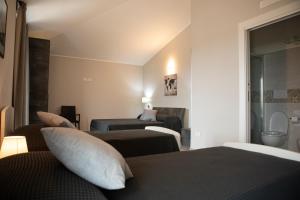 A bed or beds in a room at Un passo dal mare - Guest House