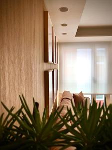 a living room with a couch and a window at the matter Meaningful apartments in Las Palmas de Gran Canaria