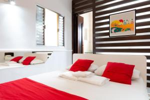 Tempat tidur dalam kamar di Hotel Anália Franco