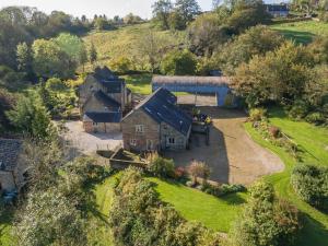 an aerial view of a house on a hill at Green Farm Cottage in Ashbourne