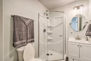a bathroom with a shower and a toilet and a sink at Cozy Cottage on the Coast Near Downtown Westport! in Westport +16 photos