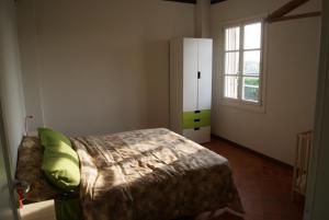 a bedroom with a bed and a window at Ostello Dei Concari in Governolo