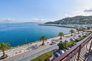 a view of a road and a body of water at Apartment with balcony in Porto Santo Stefano 89 m² sea view in Porto Santo Stefano