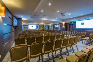a conference room with a row of chairs and a screen at Best Western Plus Hotel Perla Del Porto in Catanzaro Lido