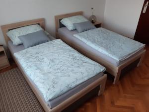 Postel nebo postele na pokoji v ubytování Apartman Helena