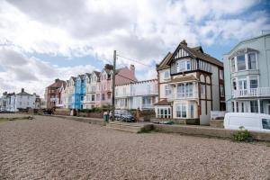 a row of houses on a street in a town at Tower House, Aldeburgh in Aldeburgh