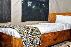 Un ou plusieurs lits dans un hébergement de l'établissement Africa Safari Camping Mto wa Mbu