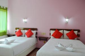 Postel nebo postele na pokoji v ubytování Hotel Kashlan Palenque