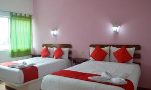 Postel nebo postele na pokoji v ubytování Hotel Kashlan Palenque