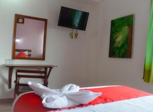 Postel nebo postele na pokoji v ubytování Hotel Kashlan Palenque