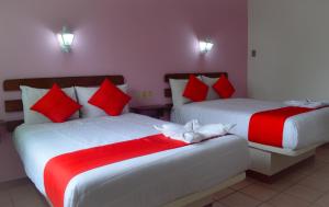 Postel nebo postele na pokoji v ubytování Hotel Kashlan Palenque
