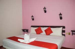 Postel nebo postele na pokoji v ubytování Hotel Kashlan Palenque
