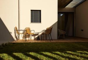 a patio with chairs and a table on a deck at ChillHouse_Porto - Praça da República in Porto