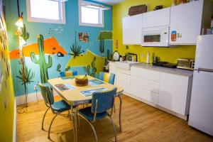 a kitchen with a table and chairs in a room at Object Hotel 1BR Shared Bath Room 2C in Bisbee