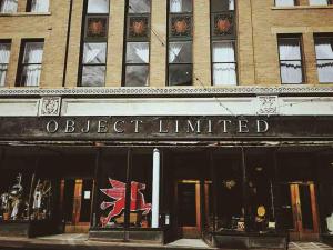 a building with a sign that reads object limited at Object Hotel 1BR Shared Bath Room 2C in Bisbee