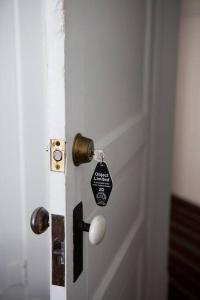 a door with a tag attached to it at Object Hotel 1BR Shared Bath Room 2D in Bisbee