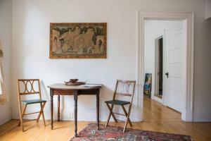 a dining room with a table and two chairs at Object Hotel 1BR Room 3A in Bisbee