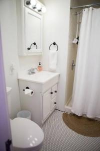 a bathroom with a sink and a toilet and a mirror at Object Hotel 1BR Room 3E in Bisbee