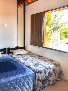 Tempat tidur dalam kamar di Casa de praia em Carapibus