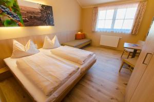 Postel nebo postele na pokoji v ubytování JUFA Hotel Neutal