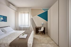 מיטה או מיטות בחדר ב-Il Piccolo Albero