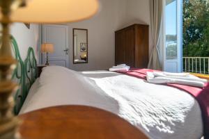 A bed or beds in a room at IV Casale Roma Country Villa