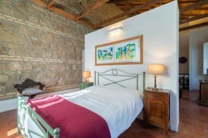 A bed or beds in a room at IV Casale Roma Country Villa Még 37 kép