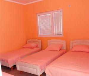 Postel nebo postele na pokoji v ubytování Apartmans Hari