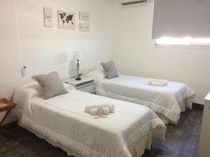 מיטה או מיטות בחדר ב-Namaste