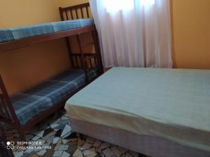 Postel nebo postele na pokoji v ubytování Chácara Santana + 22 fotografií