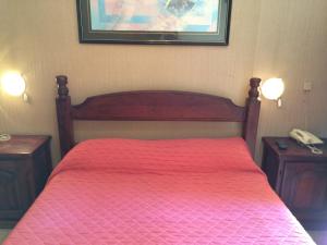 Una cama o camas en una habitación de Hotel Cordoba