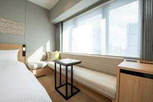 Voodi või voodid majutusasutuse Miyako City Tokyo Takanawa toas